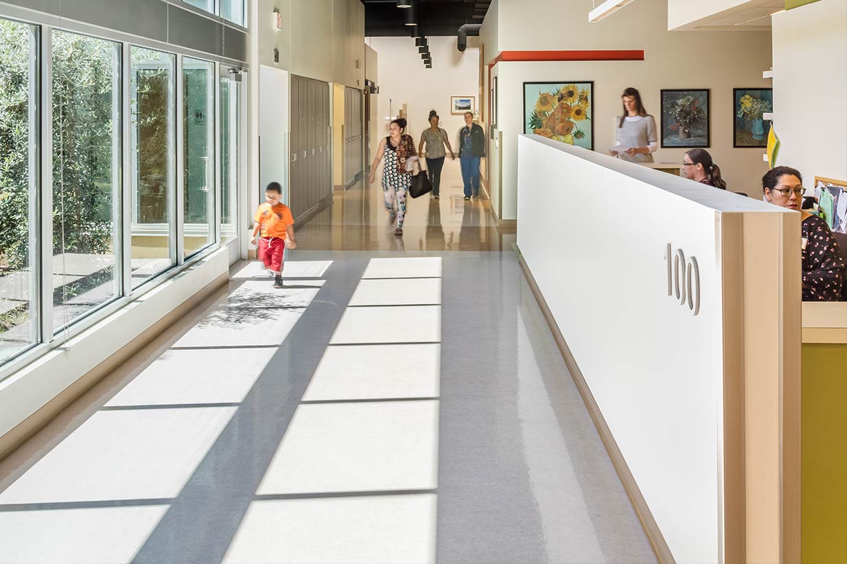 Family walking down lobby hallway