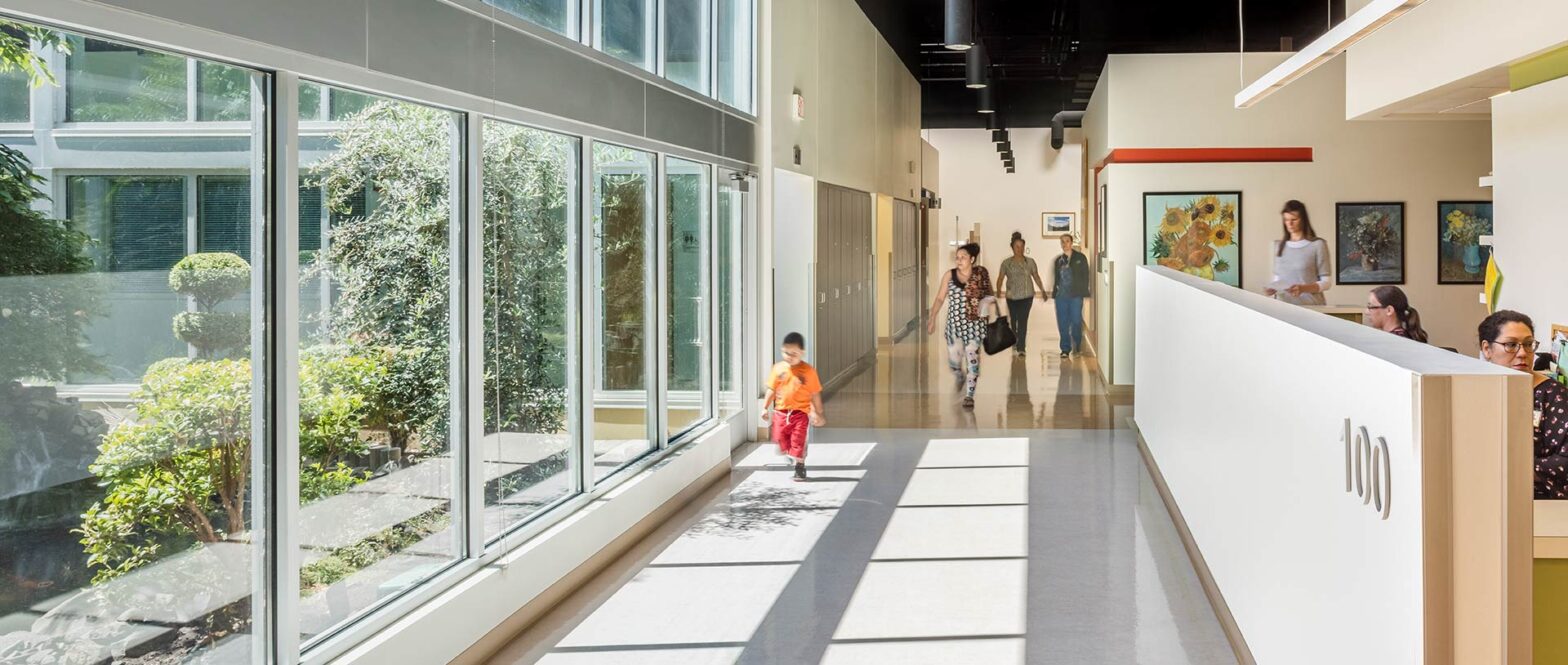 Family walking down lobby hallway