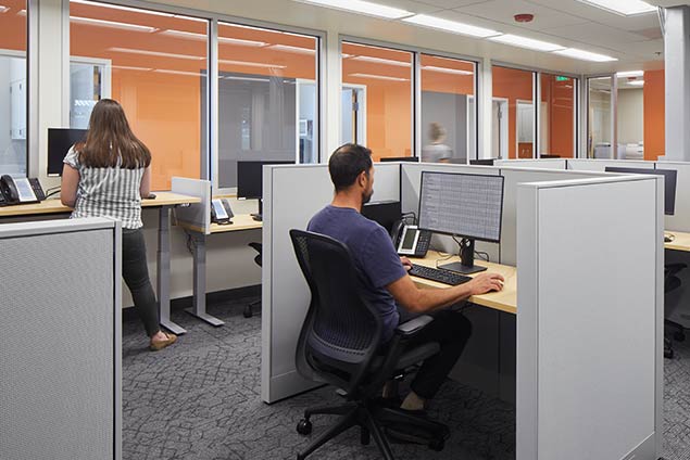 Man and woman working at workstation