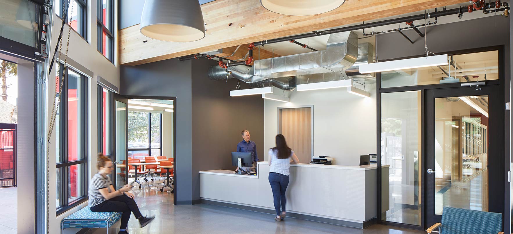 Lobby with woman standing at front desk