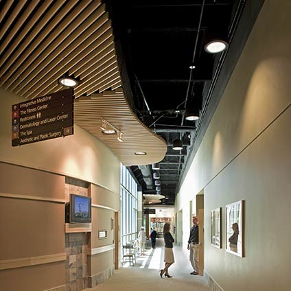 Two people talking at interior hallway