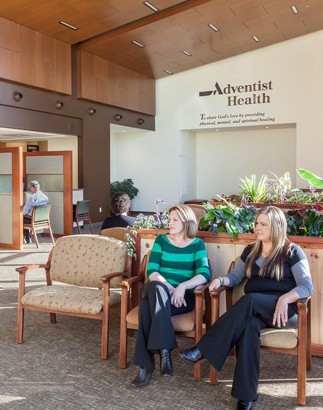 Two women waiting in lobby