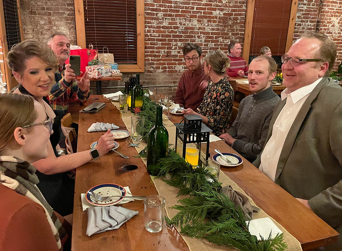 CKA staff at table for company holiday party