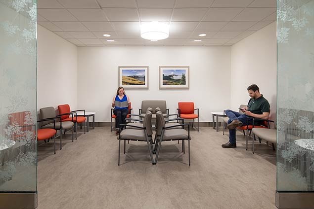 Two people in a waiting room