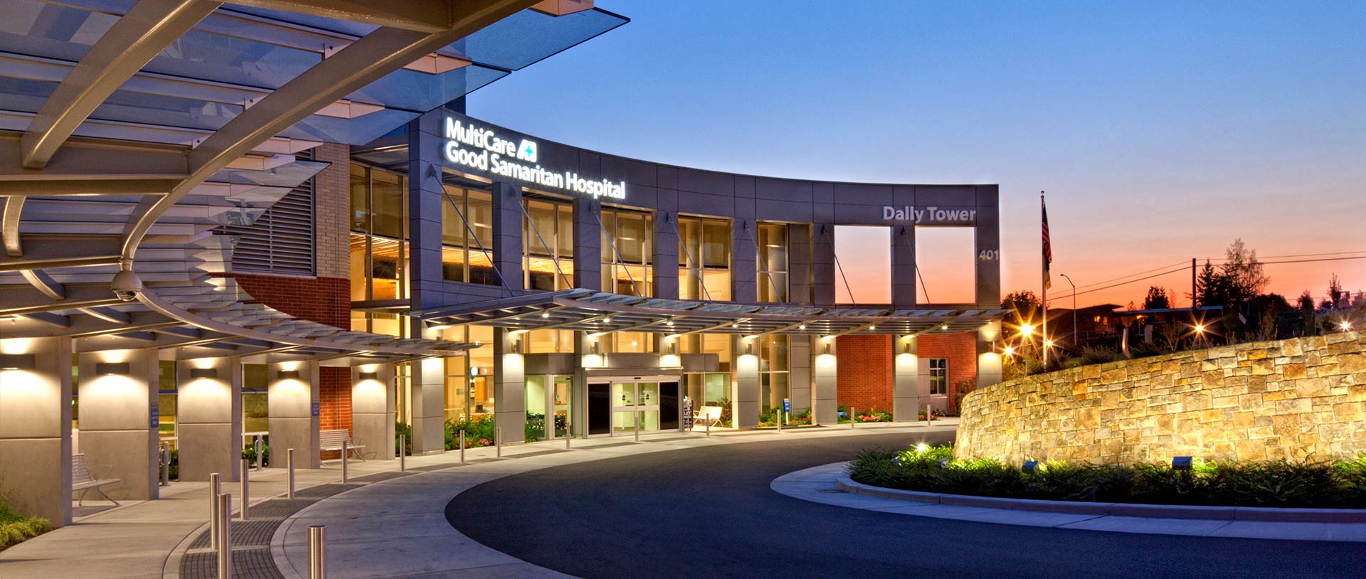 Nighttime exterior photo of hospital driveway